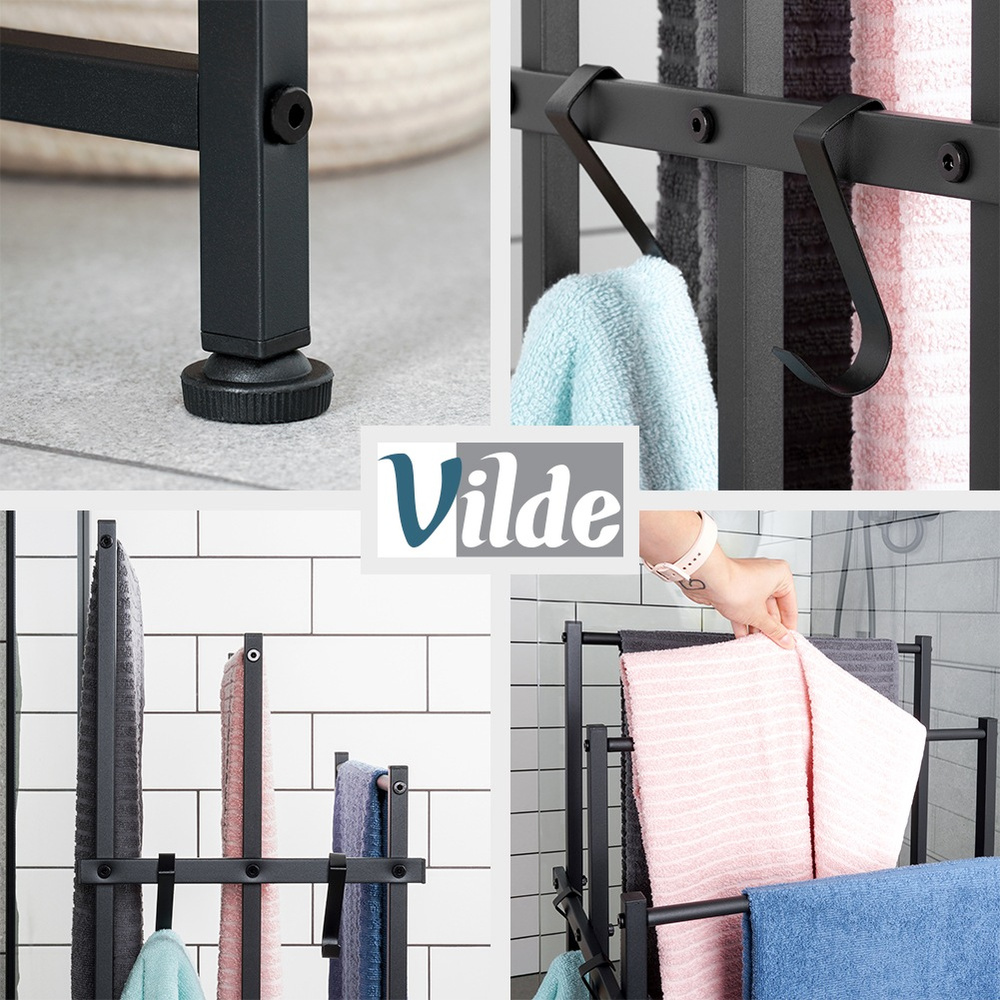 Musta metallinen seisova pyyheteline